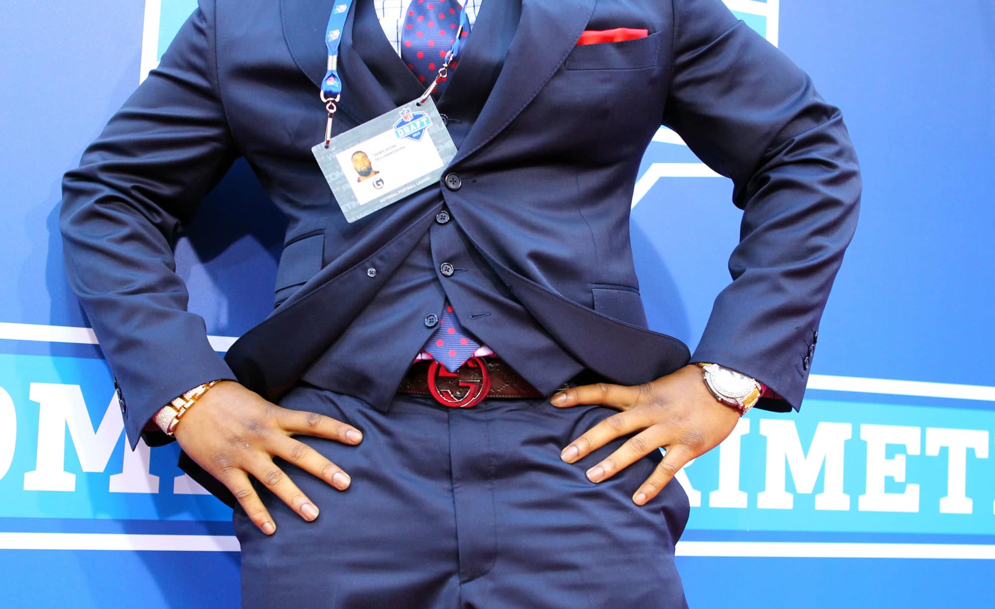 Style at the NFL draft means belts, vests, earrings, and lots of bling on the watch.