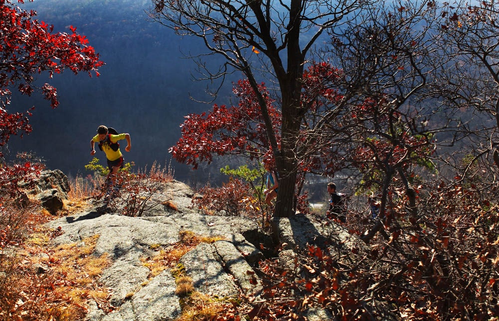An endurance runner reaches the top of the rugged Pyngyp in Harriman State Park during the first Irishman's Suffern to Bear Mountain Run.