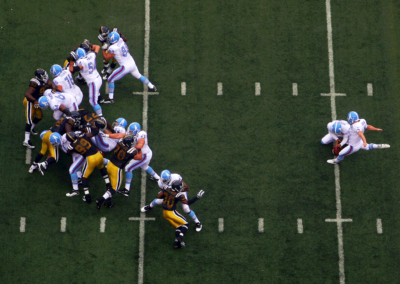 An overhead view of New Jersey Jets making a field goal attempt.