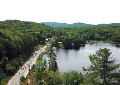 Bikers skirt little Fifth Lake in Inlet, New York, during the Black Fly Challenge Bike Race in June, 2018. Photo by Suzy Allman